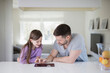 © Johnér - Father and daughter using digital tablet