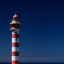 Gran Canaria, North Coast, Area Around Punta Sardina Cape, Lighthouse On Blue Sky Background, Teide On Tenerife Visible


