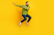 Full length photo of mature man happy positive smile jump up dance dab hip-hop isolated over yellow color background