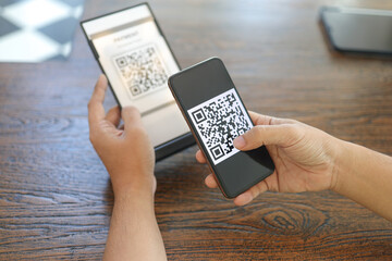 Qr code payment. E wallet. Man scanning tag accepted generate digital pay without money.scanning QR code online shopping cashless payment and verification.technology concept