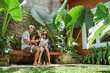 © Odua Images - portrait of asian family enjoy their time at tropical backyard at home