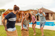 © Impact Photography - Friends jumping in sacks and racing in the backyard