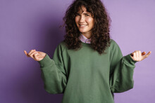 Happy Puzzled Curly Girl Smiling And Gesturing With Hands