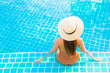 © siraphol - Portrait beautiful young asian woman relax smile leisure around outdoor swimming pool
