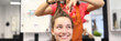© H_Ko - Female client sits in chair in a hairdressing salon. The master holds hair and scissors. Hairdressing training concept