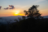Fototapeta Niebo - A beautiful evening sunset over the mountains In Nan Province, Thailand.