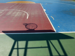 Wall Mural - colorful basketball lines on an outdoor court with shadow