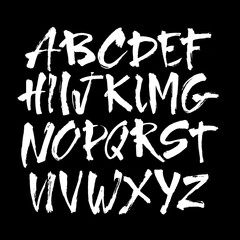 Wall Mural - vector acrylic brush style hand drawn alphabet font. calligraphy alphabet on a black background