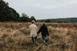 © Johnér - Female couple walking through meadow