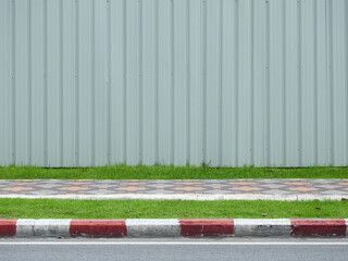 Canvas Print - metal sheet of fence on footpath in street