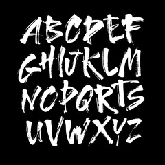 Wall Mural - vector acrylic brush style hand drawn alphabet font. calligraphy alphabet on a black background