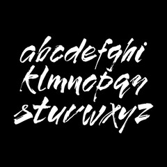 Wall Mural - vector acrylic brush style hand drawn alphabet font. calligraphy alphabet on a black background