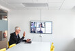 © Johnér - Man in boardroom having video conference