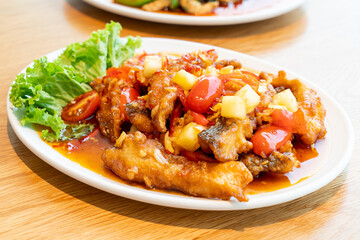 Sticker - fried grouper fish topped with sweet ,sour and hot sauce