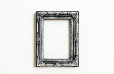 Wall Mural - empty picture frame on white wall background