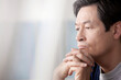 © Image Source RF - Mature man with hands on chin