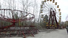 Abandoned Carousel And Abandoned Ferris At An Amusement Park In The Center Of The City Of Pripyat, The Chernobyl Disaster, The Exclusion Zone, A Ghost Tow