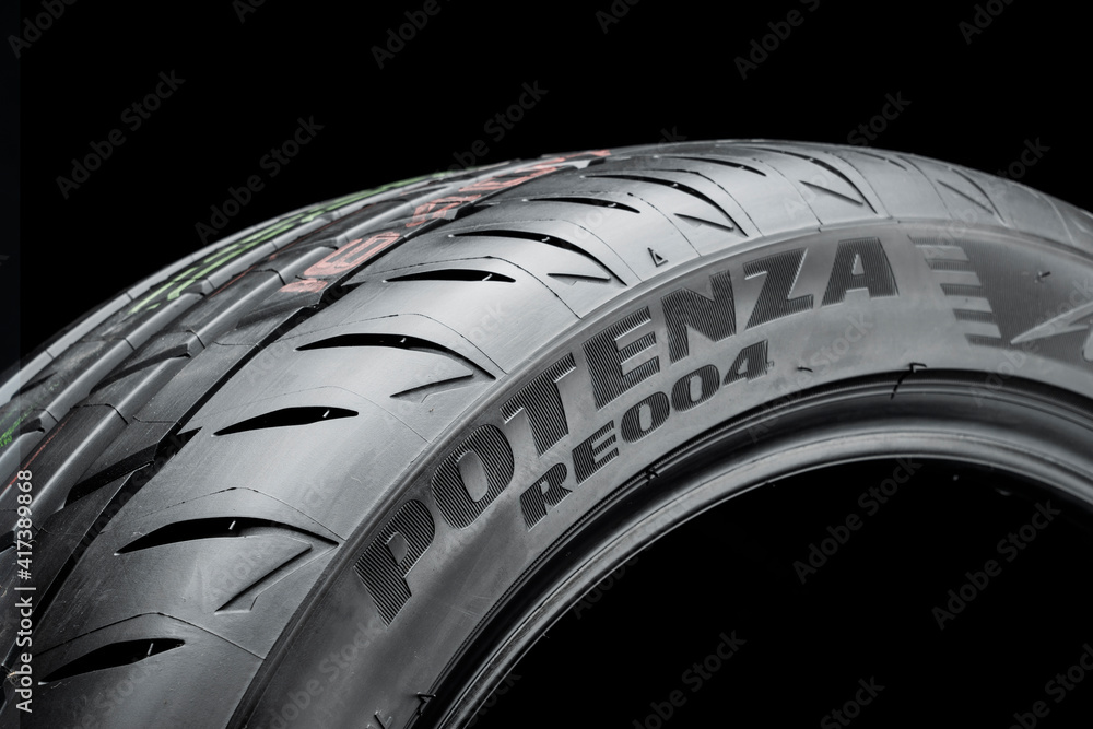 tires Bridgestone Potenza adrenalin re 004-new safe sports tire, logo on the sidewall の Stock フォト