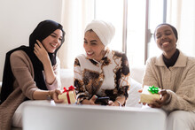 Three Young Muslim Women On Video Call With Gifts