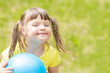 © Ermolaev Alexandr - Happy little girl with syndrome down holds ball in a summer park. Empty space for text