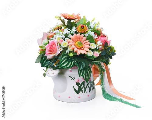 Flower arrangement in a vase in the form of a watering can © Andrey Zyk