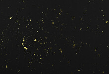 Gold Flakes Of Potal On Black Textured Paper