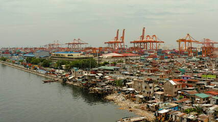 Wall Mural - Aerial view of container terminal in the city of Manila. Largest cargo port. modern harbor and global trade background ,Philippines.