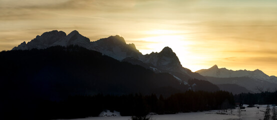 Wall Mural - sunset in the mountains - panorama of zugspitze and alpspitze during epic sahara dust sunset
