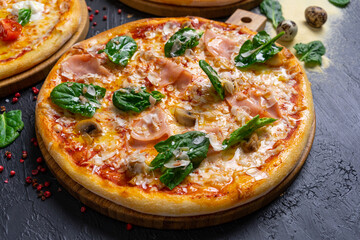 Wall Mural - Italian pizza with cheese and mushrooms on a wooden background (top view close)