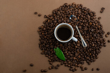 Coffee and coffee beans on a brown background