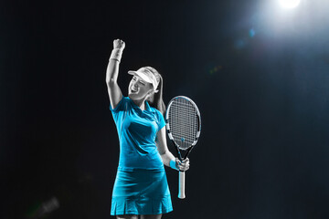 Tennis player with racket in blue costume. Woman athlete playing on grand arena background.