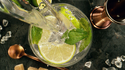 Poster - Pouring soda into mojito cocktail