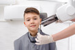 © lisovoy - Dentist make jaw x-ray image for little boy in dental clinic