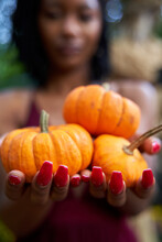 Black Woman Explores Outdoor Pumpkin Patch, Nature