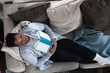 © Gerald Carter/Creative Flame - Black woman relaxed on couch at home, comfortable,sleep