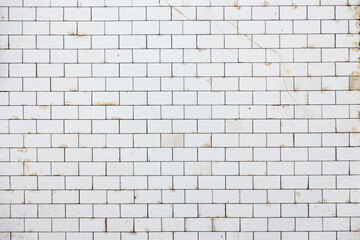 background of white historic glazed tiles