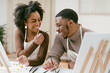 © Melissa Alexander/Creative Flame - Black couple has fun painting and laughing during date night, paint and craft DIY