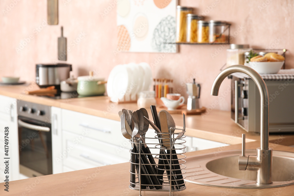 Different utensils on kitchen counter