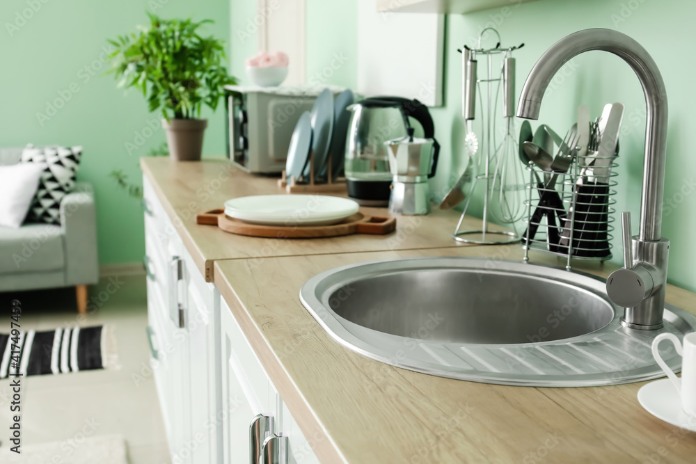 Sink in interior of modern kitchen