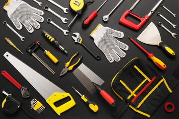 Set of construction tools on dark background