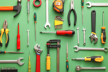 Set of construction tools on color background