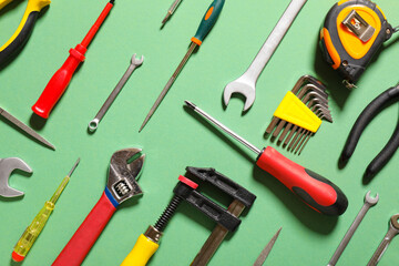 Set of construction tools on color background