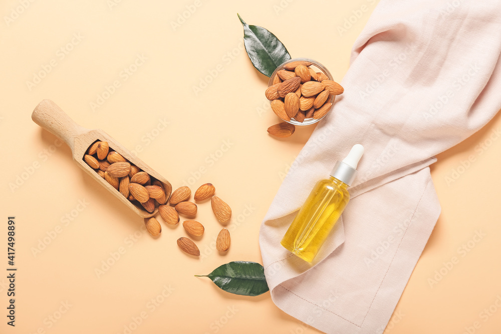 Composition with almond oil on color background