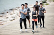 © imtmphoto - group of young asian adults running outdoors