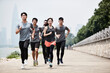 © imtmphoto - group of young asian adults running outdoors