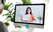 Video conference, Work from home, Asian woman holding business chart  while making video call to business team with virtual web on computer at home