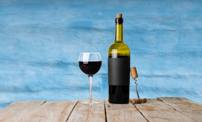 Wall Mural - Red wine glasses and bottle on stone background. Top view with copy space