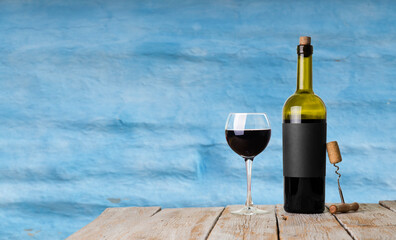 Wall Mural - Red wine glasses and bottle on stone background. Top view with copy space