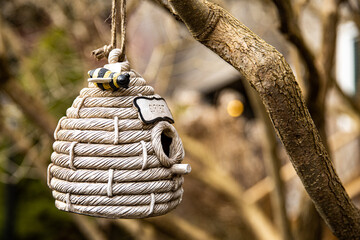 bird's nest ornament decoration hanging on a tree in early spring