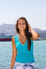 Young woman by the sea in Zakynthos Greece